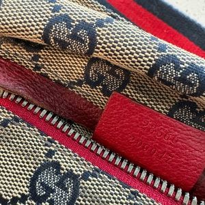 Gucci Belt Bag | GUCCI GG Monogram Double Pocket Belt Bag in Blue / Red Canvas.